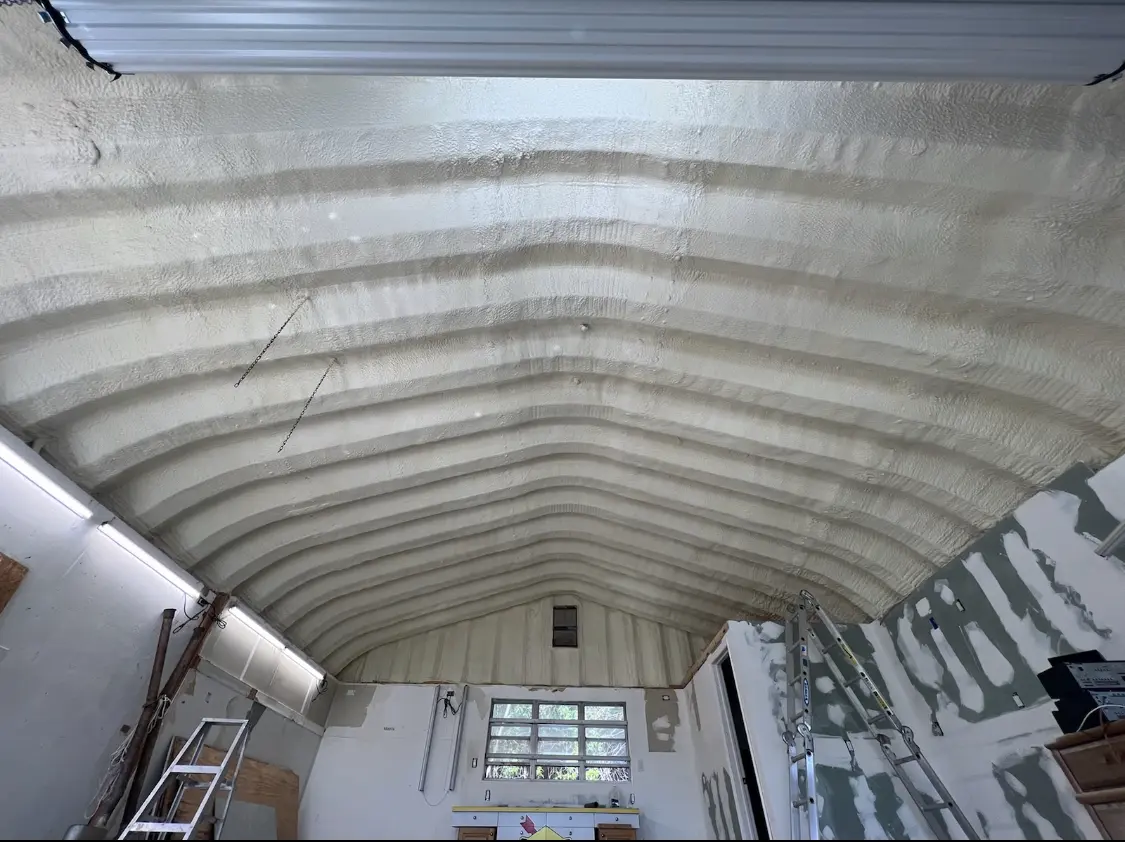 Spray polyurethane foam applied to the underside of a metal roof deck in Marshfield